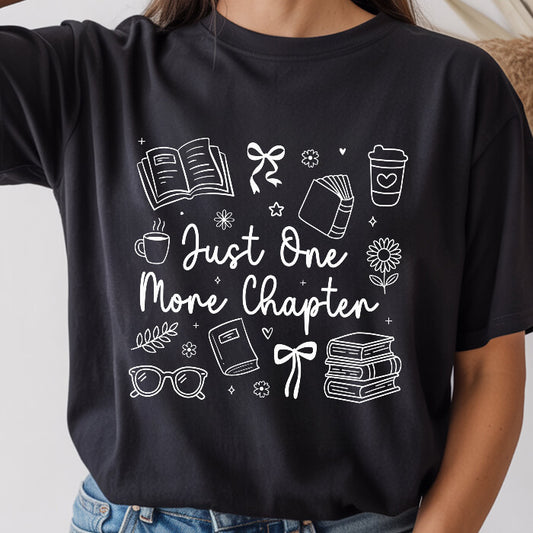 Just One More Chapter Cozy black bookish t-shirt – cozy Comfort Colors 1717 garment-dyed tee for readers who live between chapters.