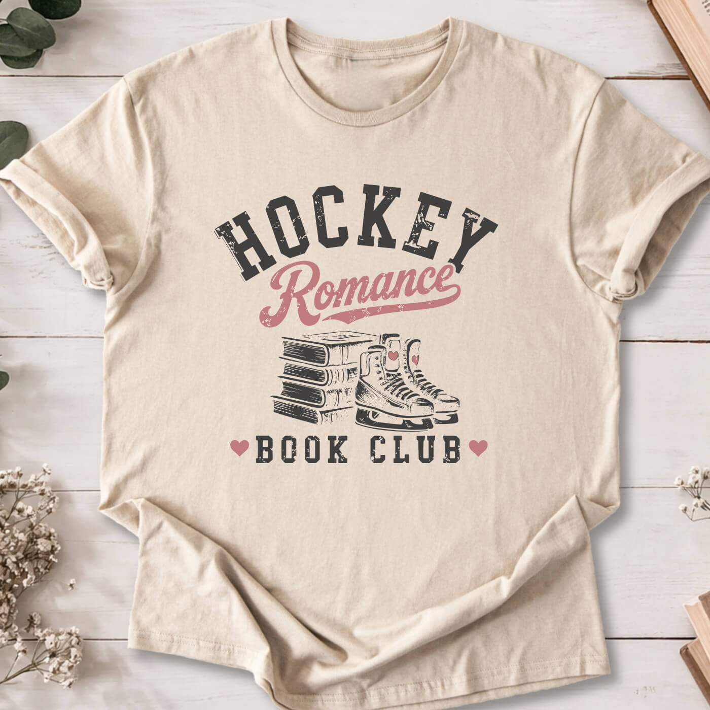 Hockey Romance Book Club t-shirt on sand Gildan 64000 featuring books and hockey skates.