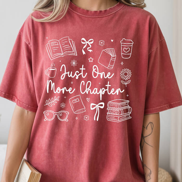 Just One More Chapter Cozy crimson bookish t-shirt – cozy Comfort Colors 1717 garment-dyed tee for readers who live between chapters.