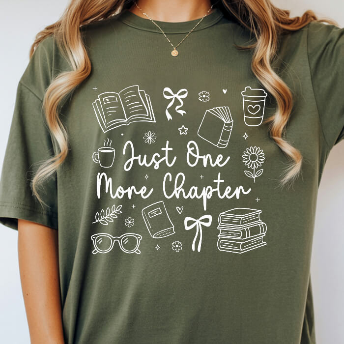 Just One More Chapter Cozy moss bookish t-shirt – cozy Comfort Colors 1717 garment-dyed tee for readers who live between chapters.