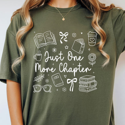 Just One More Chapter Cozy moss bookish t-shirt – cozy Comfort Colors 1717 garment-dyed tee for readers who live between chapters.