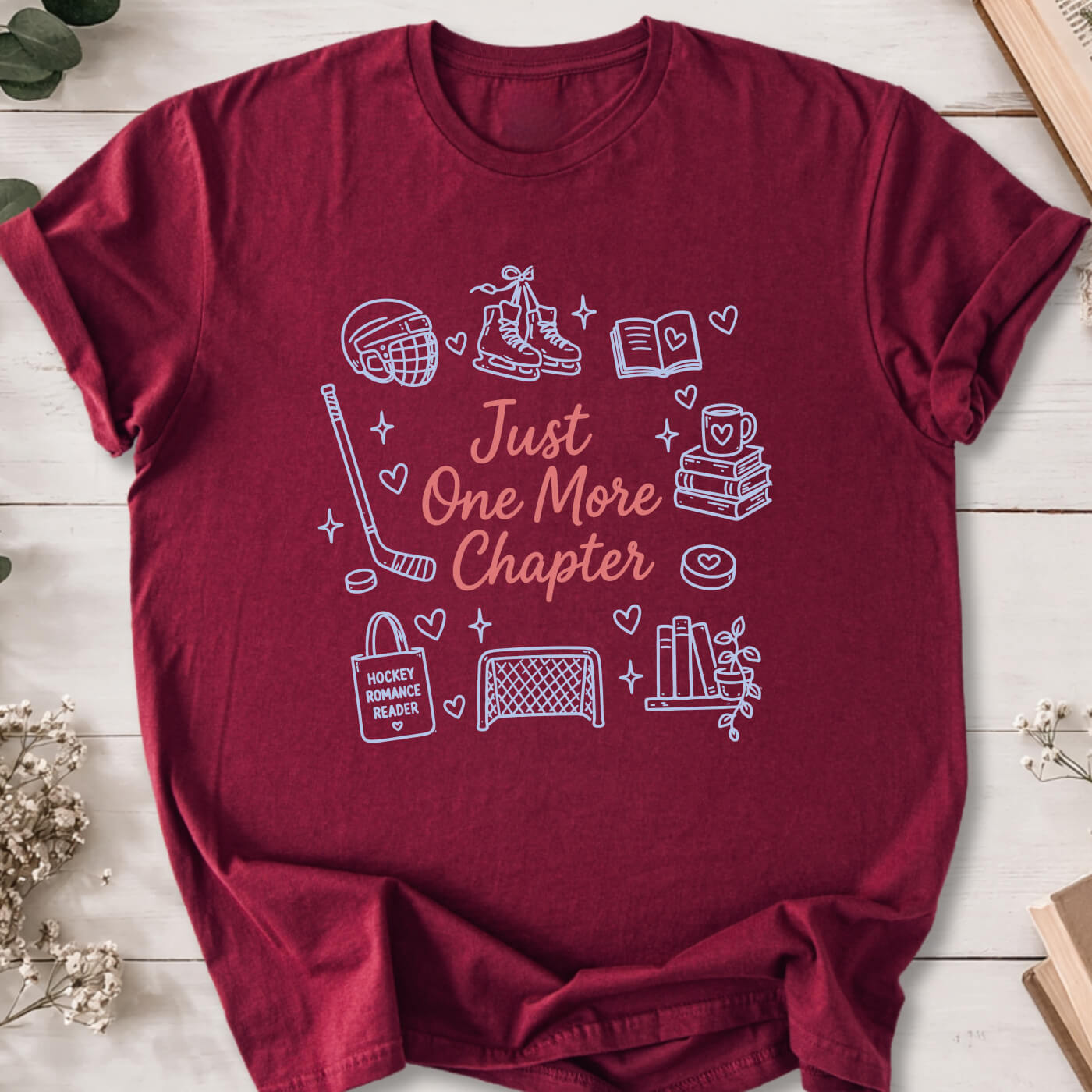 Just One More Chapter hockey romance doodle t-shirt on marron Gildan 64000 with hockey, books and reader icons.
