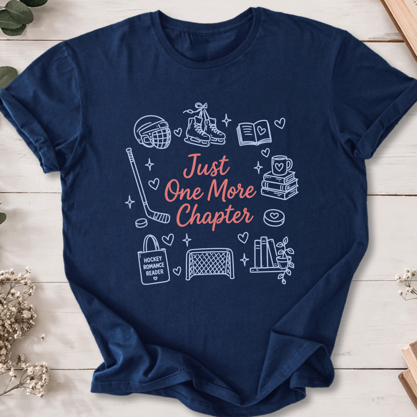 Just One More Chapter hockey romance doodle t-shirt on navy Gildan 64000 with hockey, books and reader icons.