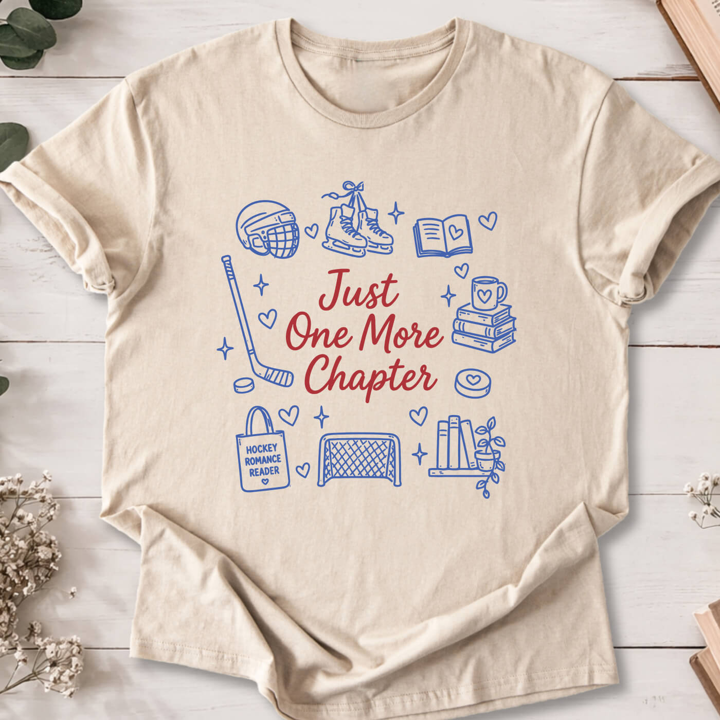 Just One More Chapter hockey romance doodle t-shirt on sand Gildan 64000 with hockey, books and reader icons.