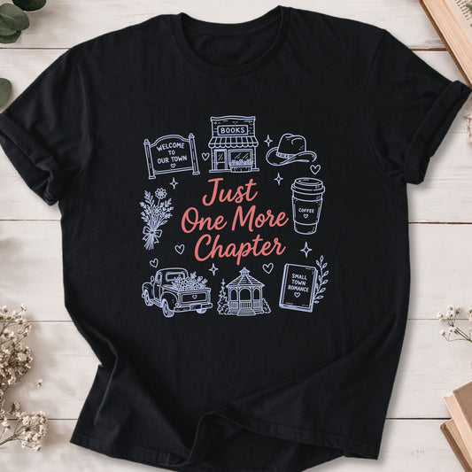 Just One More Chapter small town romance doodle t-shirt on black Gildan 64000 with cozy romance icons.