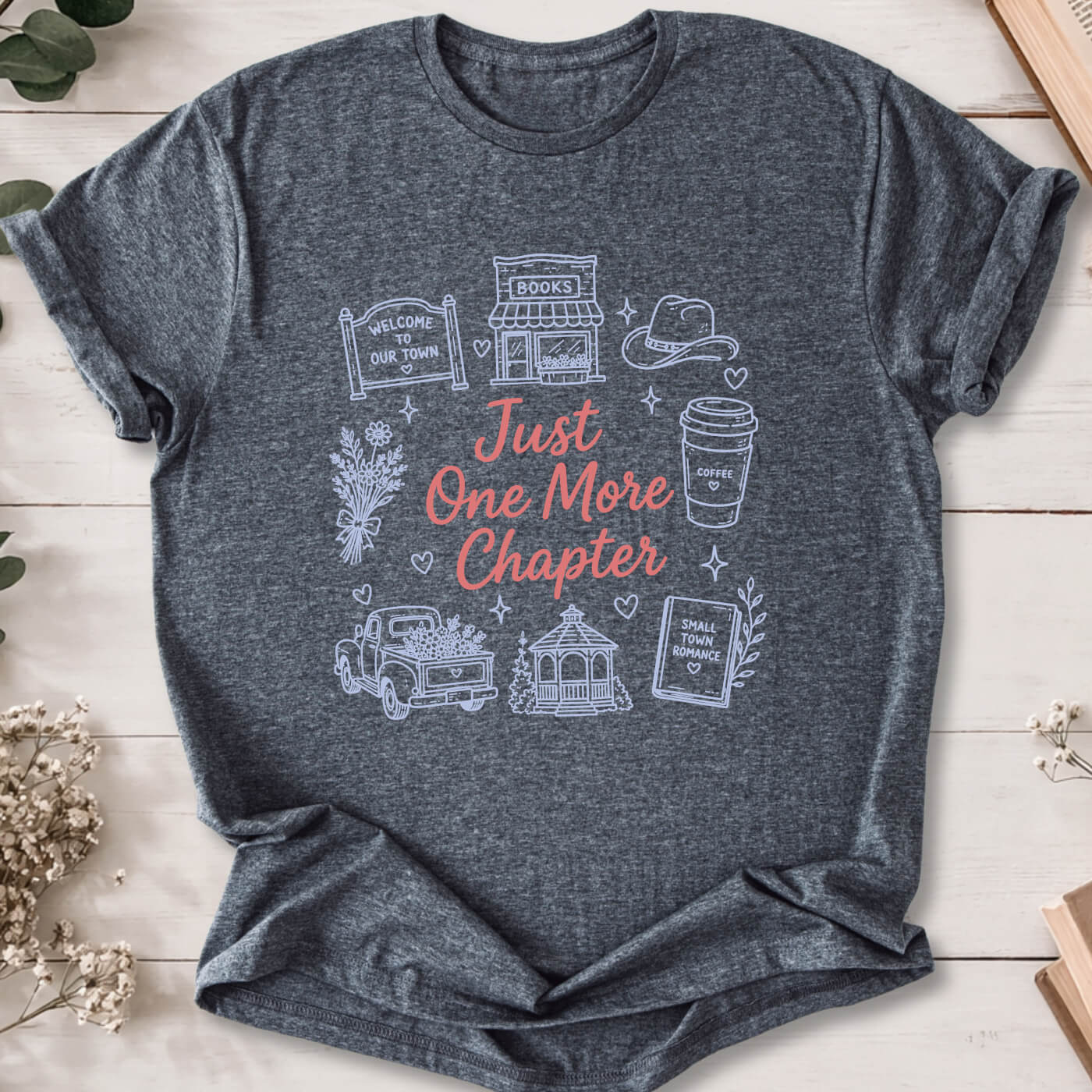 Just One More Chapter small town romance doodle t-shirt on dark heather grey Gildan 64000 with cozy romance icons.