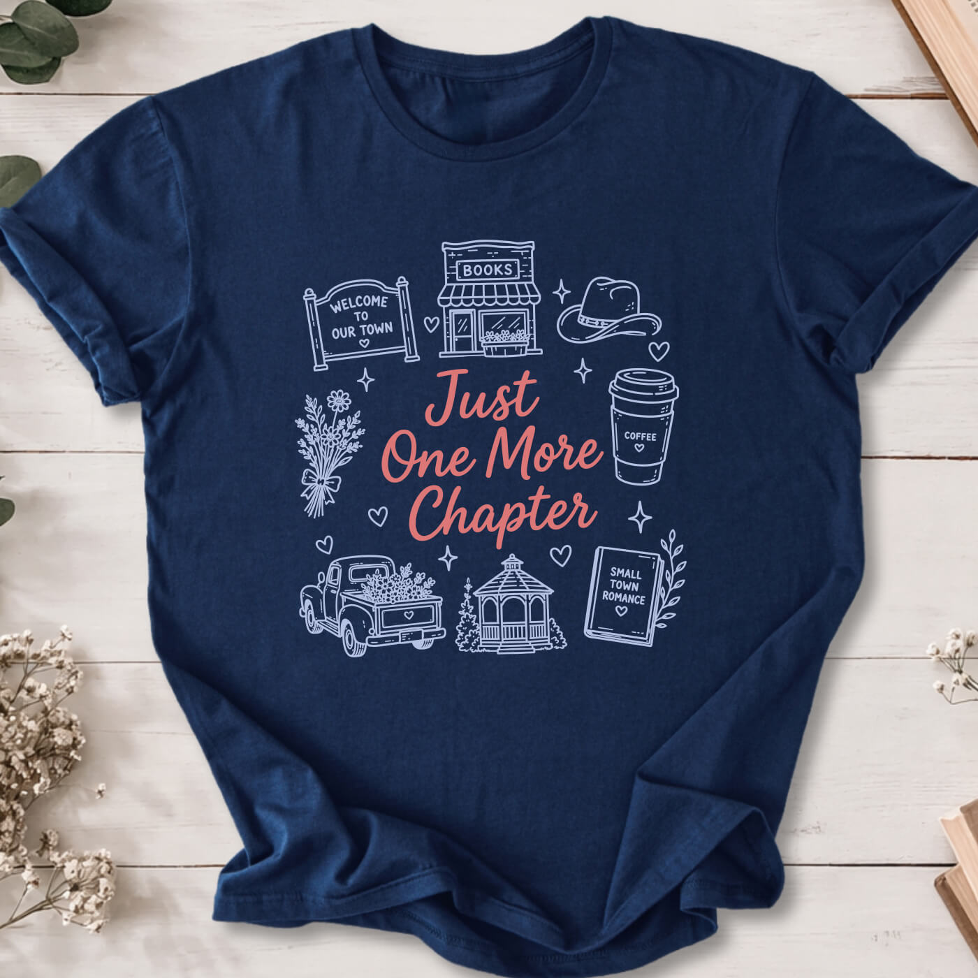 Just One More Chapter small town romance doodle t-shirt on navy Gildan 64000 with cozy romance icons.