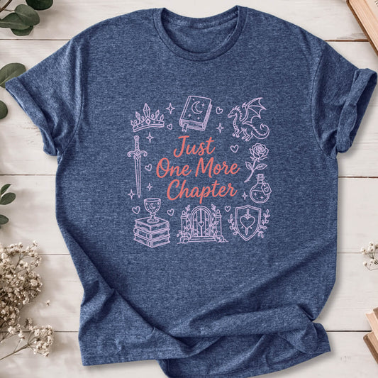 Just One More Chapter romantasy doodle t-shirt on heather navy Gildan 64000 with dragons, swords and fantasy icons.
