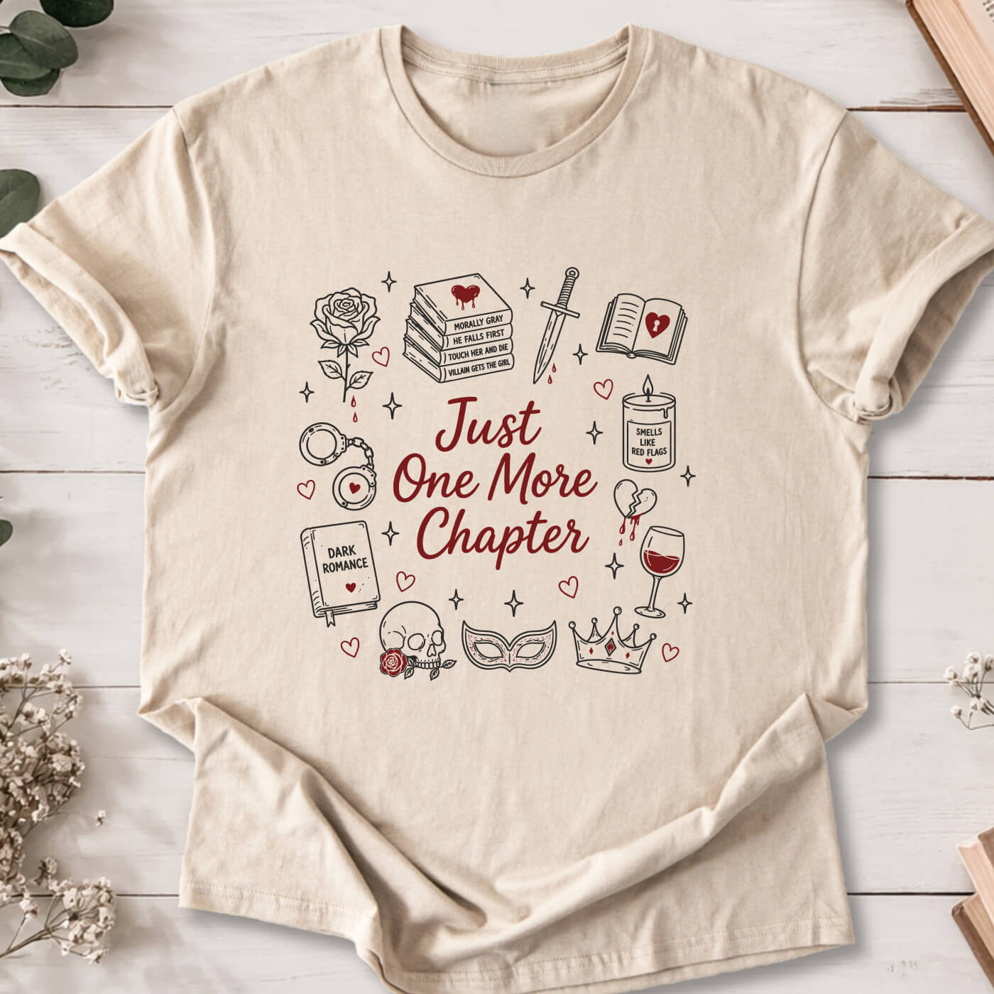 Just One More Chapter dark romance doodle t-shirt on sand Gildan 64000 featuring books, skull, roses and reader icons.